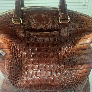 Brahmin pecan handbag with straps.